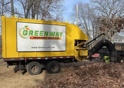 a truck with greenway property logo